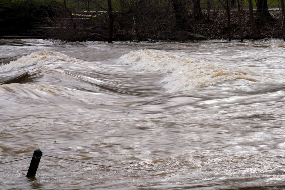 The river overflows after a heavy rainfall on campus on April 5, 2023. 