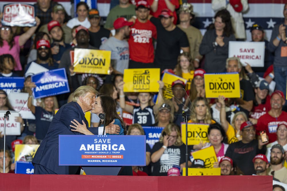 <p>Donald Trump and gubernatorial candidate Tudor Dixon at Trump’s rally held in support of Michigan’s GOP midterm ticket on Saturday, Oct. 1, 2022 at Macomb Community College. </p>