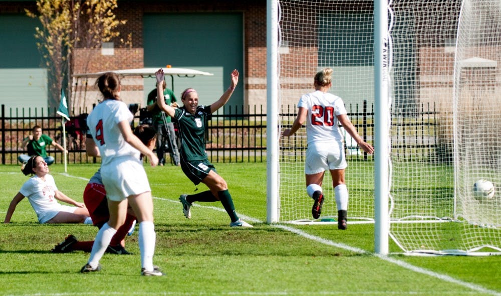 Senior forward Hannah Peterson celebrates after scoring the first goal against the Buckeyes to put MSU up, 1-0, late in the second half. The Spartans defeated Ohio State, 2-0, in their final home game on Sunday afternoon at DeMartin Stadium at Old College Field. 