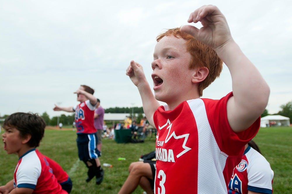 	<p>Edmonton, Alberta resident Andrew Livingstone cheers after his team scores a goal Aug. 5, 2013, at Munn Field during the World Dwarf Games. Livingstone&#8217;s team won in a penalty kick shootout. Weston Brooks/The State News</p>