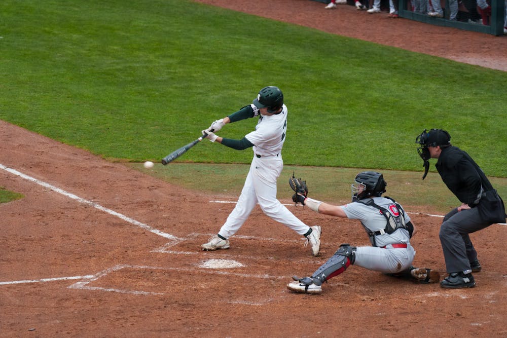 <p>Michigan State sophomore outfielder Jack Frank sending the ball flying against Youngtown State at McLane Baseball Stadium on March 30, 2022. Spartans are victorious 12-5 against Youngtown State.</p>