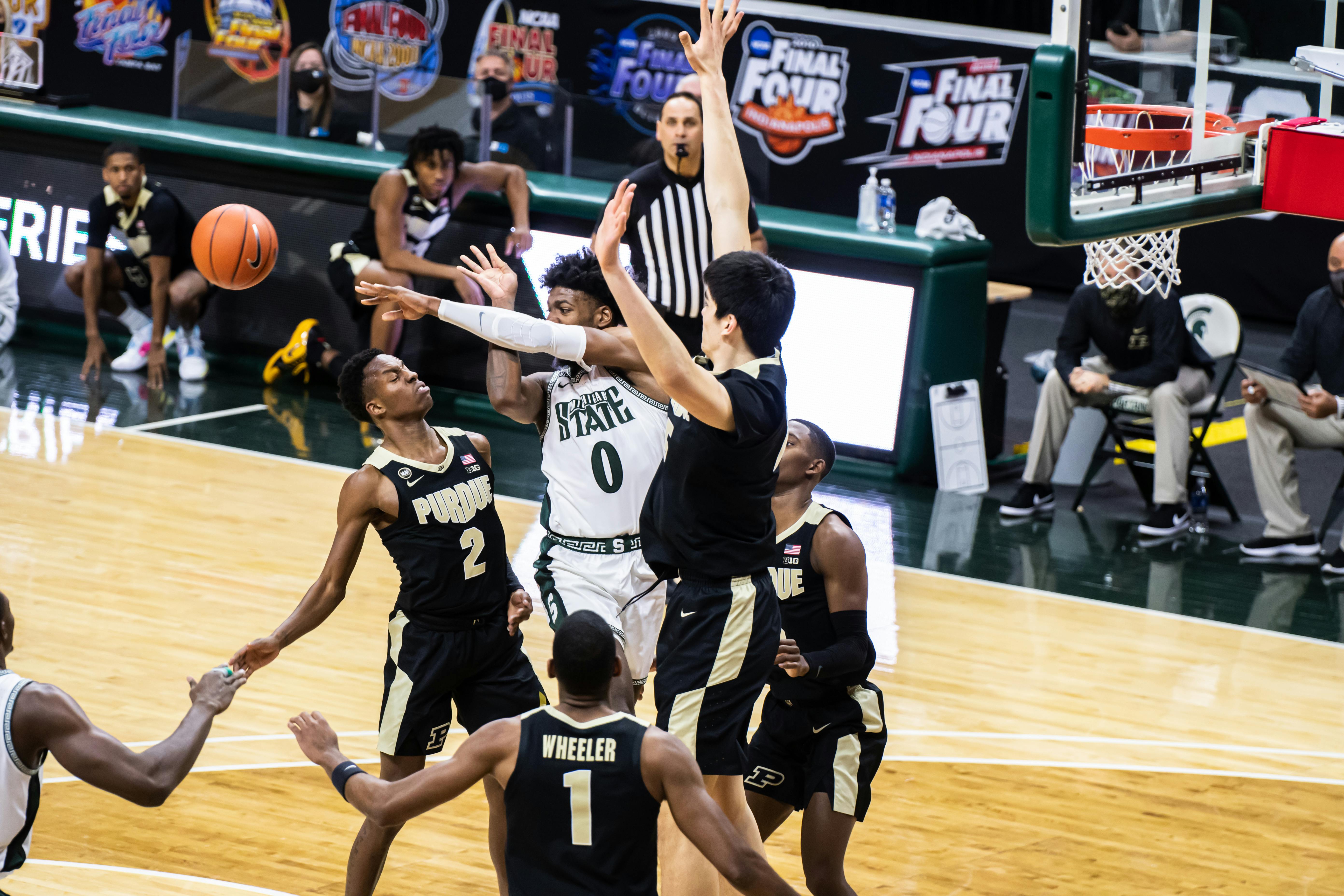 <p>Junior forward Aaron Henry is swarmed by Purdue defenders in the paint during the Spartans&#x27; 55-54 loss to Purdue on Jan. 8.</p>