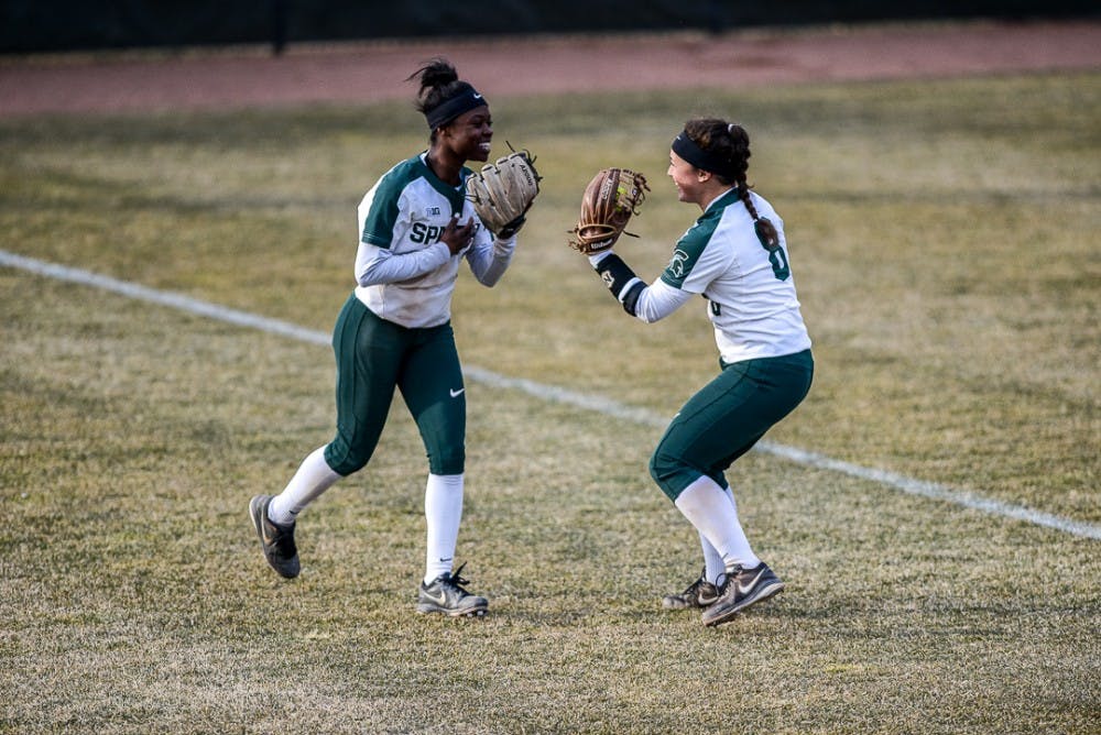 Senior outfielder Ebonee Echols (3) celebrates with teammate senior third baseman Kaitlyn Eveland (8) during the game against Oakland on April,3, 2019 at Secchia Stadium. The Spartans beat the Golden Grizzlies, 10-3   . 