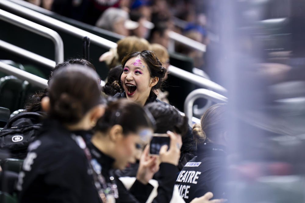 The audience cheers as the senior theater on ice teams perform at the national and gold cup competition at the Munn Ice Arena in East Lansing, Mich., on April 26, 2026. 