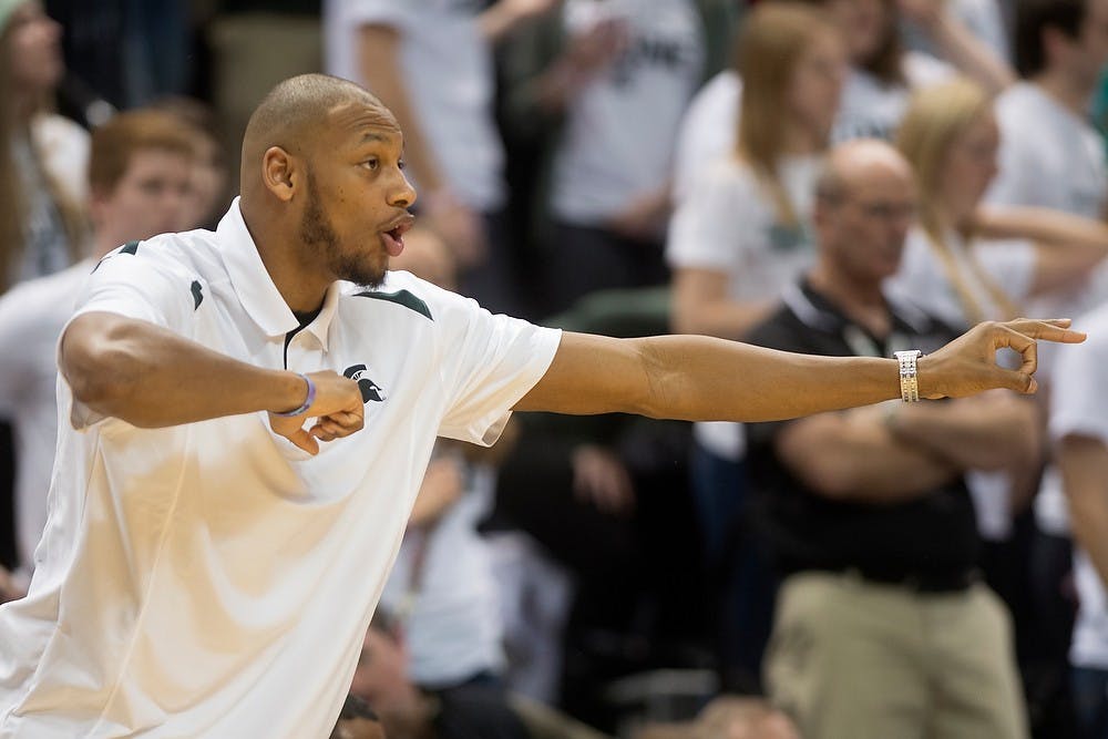 	<p>Senior center Adreian Payne motions to the team Jan. 21, 2014, at Breslin Center. The Spartans defeated the Hoosiers, 71-66. Julia Nagy/The State News</p>