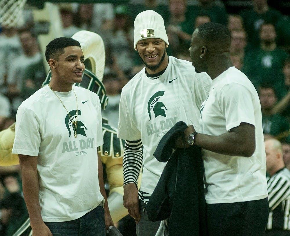 <p>Former MSU players Gary Harris, Adreian Payne, and Draymond Green greet the crowd Feb. 14, 2015, during the game against Ohio State at Breslin Center. The Spartans defeated by the Buckeyes, 59-56. Erin Hampton /The State News</p>
