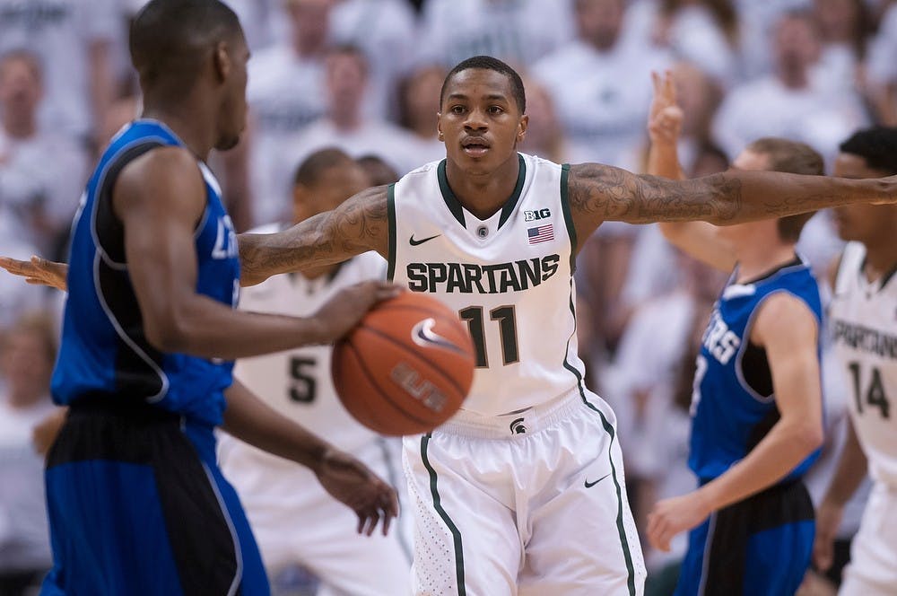 	<p>Senior guard Keith Appling guards Grand Valley State guard Rob Woodson on Oct. 29, 2013, at Breslin Center. <span class="caps">MSU</span> defeated the Lakers, 101-52. Julia Nagy/The State News</p>