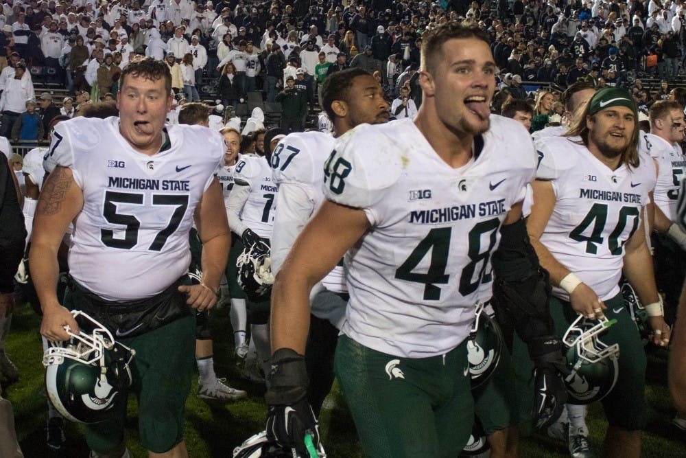 The Spartans celebrate their win against Penn State at Beaver Stadium on Oct. 13, 2018. The Spartans defeated the Nittany Lions 21-17.