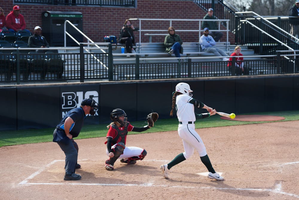 <p>Michigan State sophomore Marissa Trivelpiece making contact with the ball in the bottom of the fourth. Spartans lost 5-4 against Nebraska, on April 10, 2022.</p>