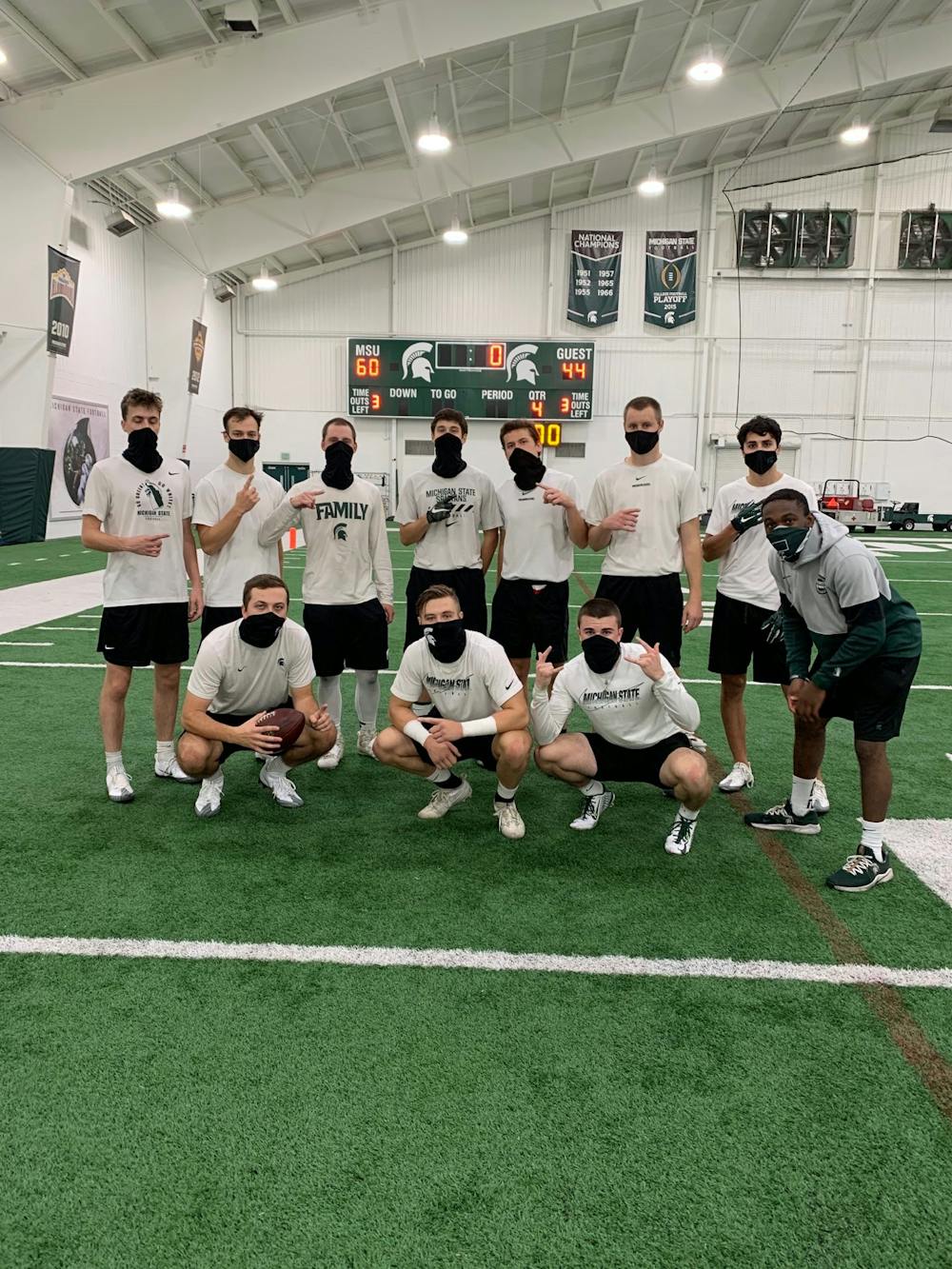 <p>Michigan State&#x27;s student equipment managers pose at the Skandalaris Football Center on the indoor practice field. </p><p>Pictured, back row (from left to right): Andrew Campbell, Michael Grodi, Dan Kalchik, Liam Ryan, Ben Connelly, Ryan Campbell, Nick Franz and Markael Butler. Front row (from left to right): Ryan Daugherty, Mason Rudy and Casey Edwards. (Photo courtesy: Ryan Daugherty, Michigan State Class of 2022)</p>