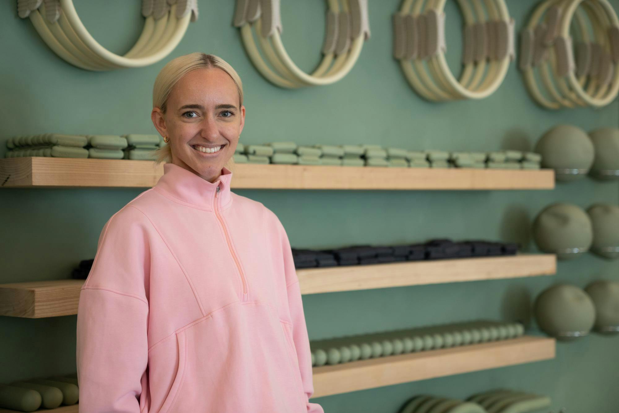 <p>Founder of Recharged Pilates Olivia Harris poses for a photo in front of equipment on June 12, 2025.</p>