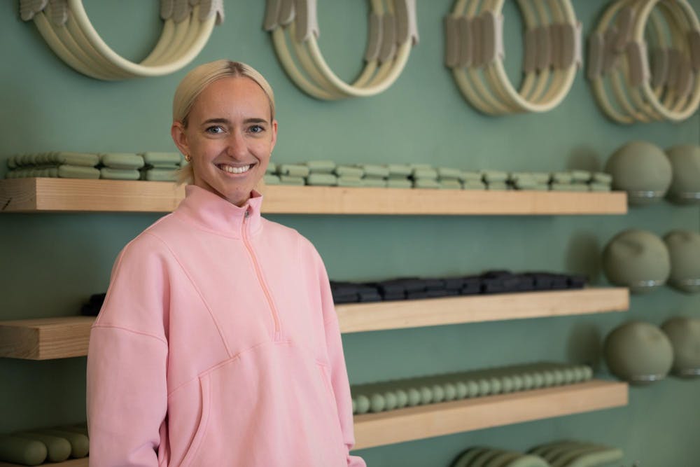 <p>Founder of Recharged Pilates Olivia Harris poses for a photo in front of equipment on June 12, 2025.</p>