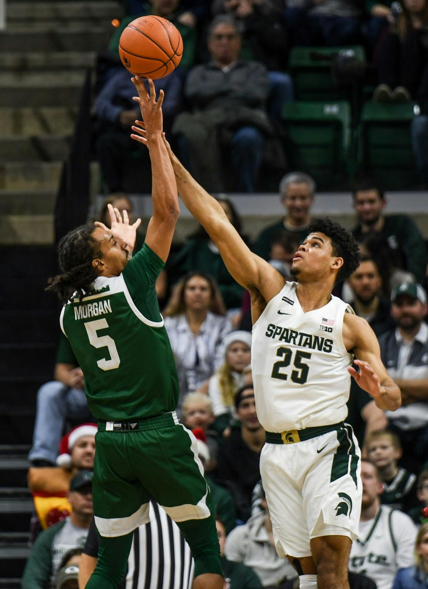 <p>Then-freshman forward Malik Hall (25) contests a shot during the game against Eastern Michigan on Dec. 21, 2019, at the Breslin Center. The Spartans defeated the Eagles, 101-48.</p>