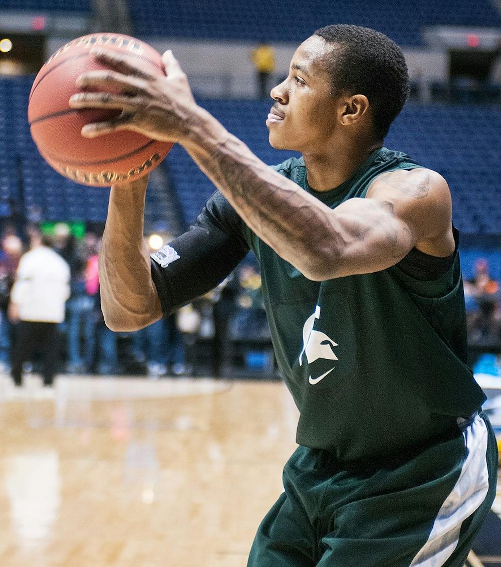 	<p>Junior guard Keith Appling takes a shot during an open practice Thursday at Lucas Oil Stadium in Indianapolis, Ind. The Spartans will play the Duke Blue Devils in the <span class="caps">NCAA</span> Tournament Sweet 16 at 9:45 p.m. Friday. Adam Toolin/The State News</p>