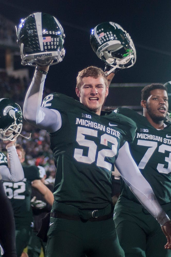 	<p>Sophomore snapper Taybor Pepper celebrates at the end of the game against Michigan on Nov. 2, 2013, at Spartan Stadium. <span class="caps">MSU</span> defeated the Wolverines, 29-6. Danyelle Morrow/The State News</p>