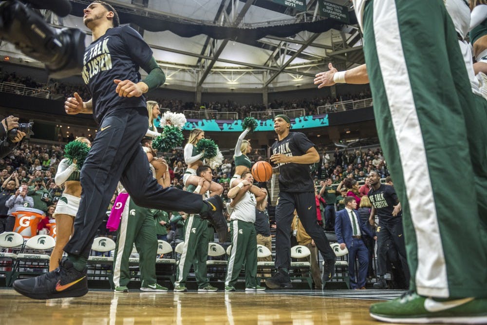 <p>The Spartans enter the court before the men's basketball game against Maryland on Jan. 4, 2018 at Breslin Center. (Nic Antaya | The State News)</p>