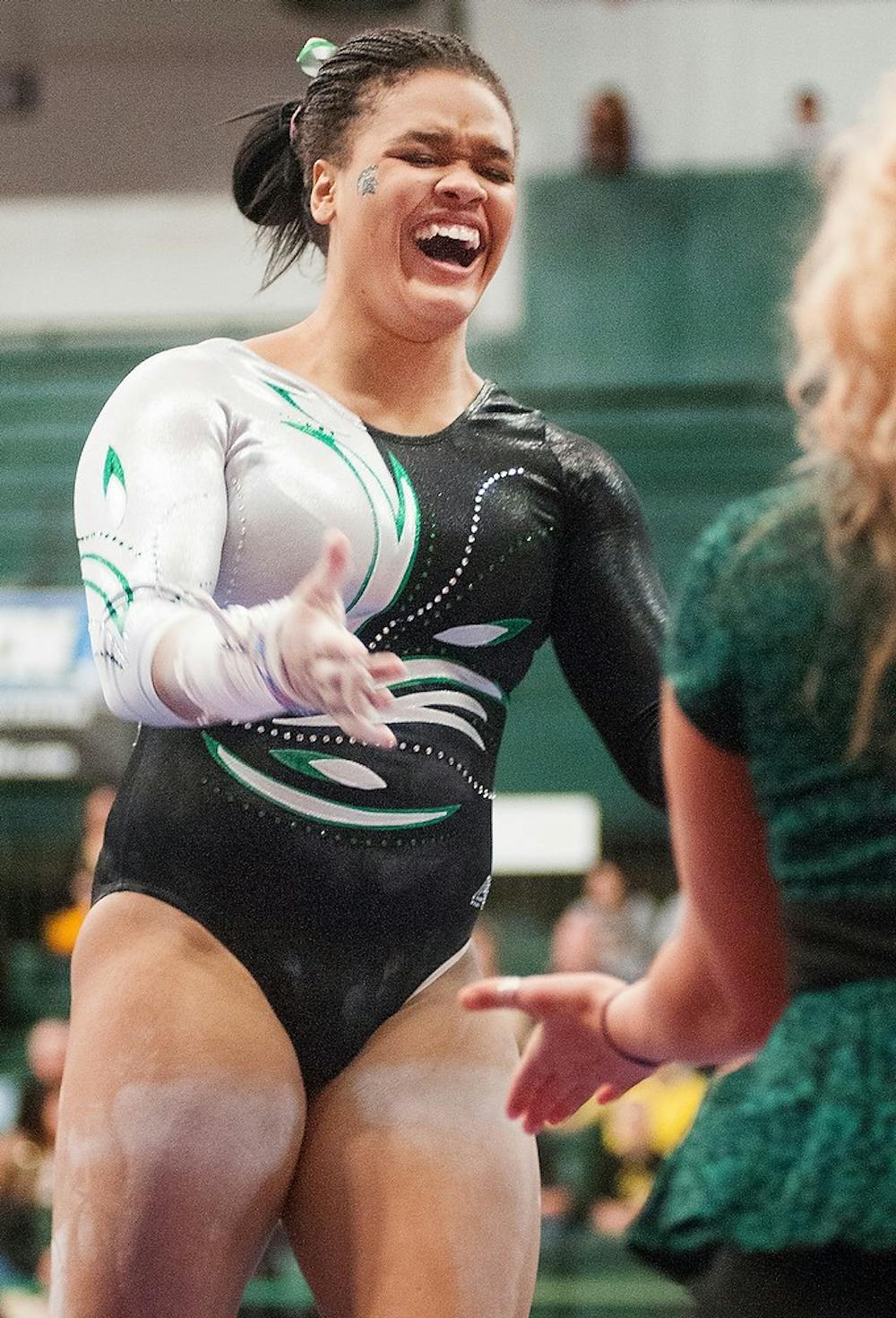 	<p>Sophomore Alina Cartwright smiles after her uneven bars routine for the Big Ten Championships on March 23, 2013, at Jenison Field House. Cartwright is one of three <span class="caps">NCAA</span> qualifiers. Natalie Kolb/The State News</p>