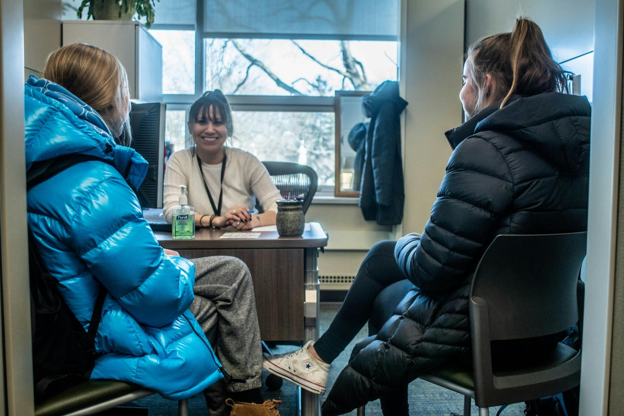 Financial Aid Officer Sara Becerril talks to students in the Office of Financial Aid on Feb. 19, 2020.