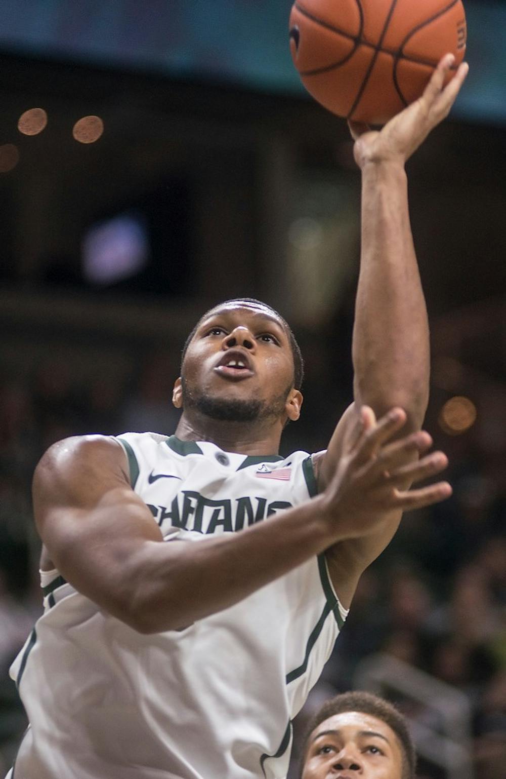 <p>Freshman forward Marvin  Clark Jr. attempts a point Nov. 24, 2014, during the game against Santa Clara at Breslin Center. The Spartans defeated the Broncos, 79-52. Erin Hampton/The State News</p>