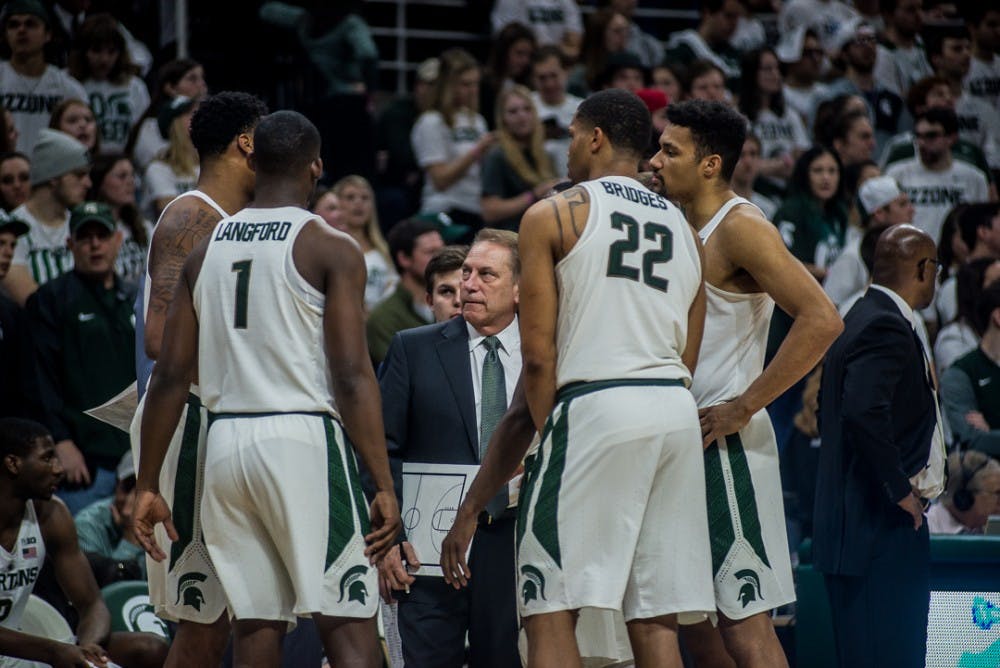 Spartans gather around head coach Tom Izzo during a timeout during the game against Penn State on Jan. 31, 2018 at Breslin Center. 