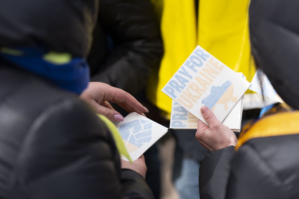 Michigan residents stand in support of Ukraine at Hart Plaza in Detroit, MI. Organizers sell stickers and accept donations for Ukranian aid. - March 28, 2022
