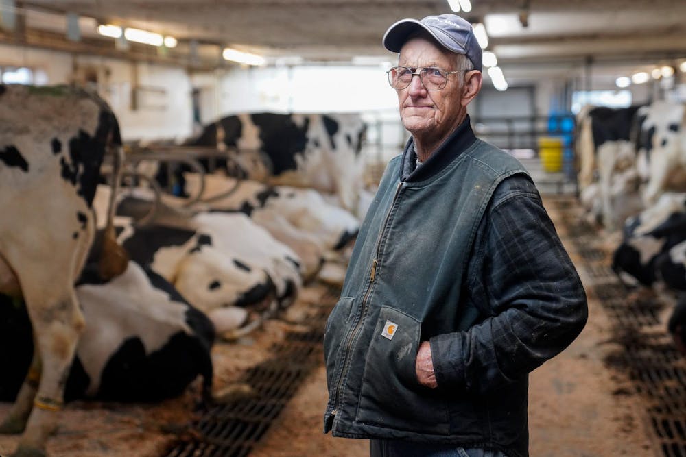 Duane Reum, 88, of Lansing, poses for a portrait at the end of his shift at at the Dairy Cattle and Research Center in Lansing on Sept. 28, 2023. 