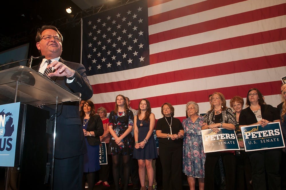 <p>Democratic candidate Gary Peters talks to supporters on Nov. 4, 2014, at MGM Grand Detroit, at 1777 3rd St. in Detroit, Mich. Peters won the Michigan's U.S. Senate seat. Aerika Williams/The State News.</p>
