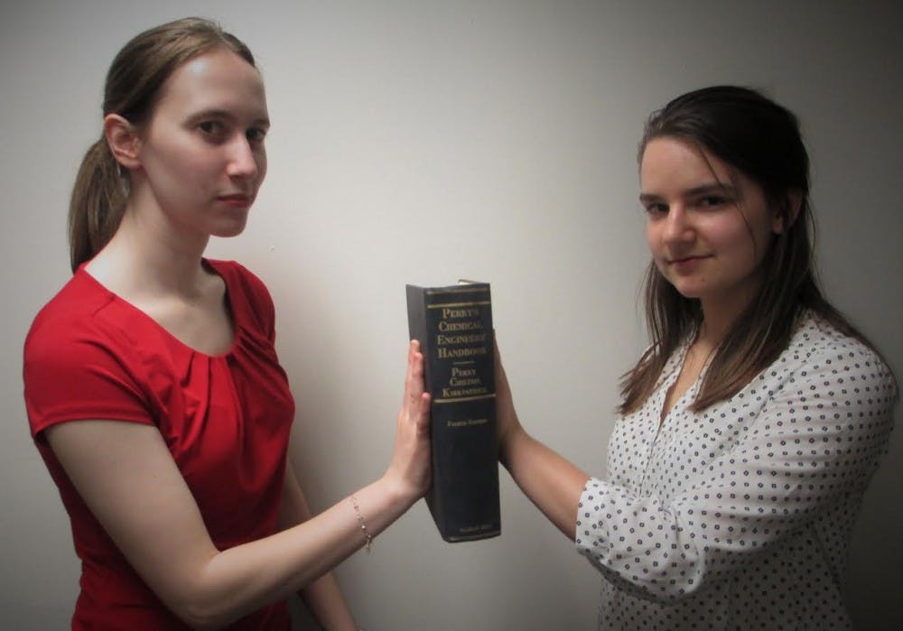 <p>Chemical engineering senior Rebecca Carlson, left, and&nbsp;MSU alumna Ariel Rose pose holding a chemical engineering handbook. The duo will&nbsp;receive&nbsp;first place&nbsp;at the&nbsp;AlChE Annual Student Conference in San Francisco on Nov. 11 to 14. Photo courtesy of&nbsp;Patricia Mroczek</p>
