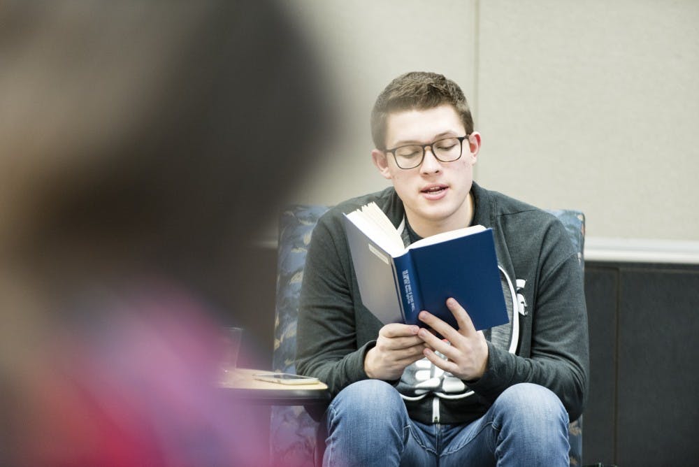 Comparative Cultures and Politics freshman Ben Peacock reads Georges Orwell's book "1984" on March 25, 2017 at Case Hall