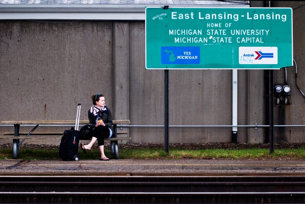 	<p><span class="caps">MSU</span> alumnus Nora Wintermute waits to return to Chicago Tuesday morning at the East Lansing Amtrak Station. Wintermute&#8217;s venture home took her over a section of track, between Battle Creek and Kalamazoo, where trains are forced to go about 20 mph slower due to a speed cap put into effect by Norfolk Southern, the Pennsylvania based company which owns the track.</p>