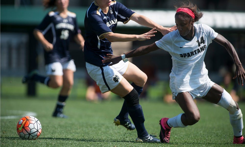 <p>Freshman midfielder/defender Alexis Warner goes after the ball as Notre Dame forward Anna Maria Gilbertson tries to stop her on Sept. 6, 2015, at DeMartin Stadium at Old College Field. The Spartans lost to the Irish, 2-0. Julia Nagy/The State News</p>
