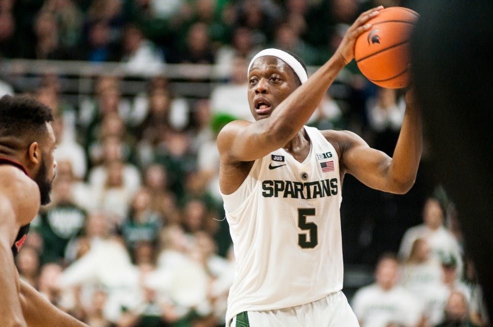 <p>Sophomore guard Cassius Winston (5) &nbsp;looks for a pass during the game against Rutgers on Jan. 10, 2018 at Breslin Center. &nbsp;The Spartans beat the Scarlet Knights in overtime 76-72. .</p>