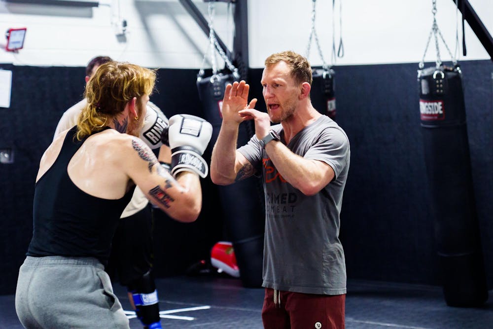 <p>Primed Combat mixed martial arts academy owner Gray Maynard demonstrates a striking drill during a mixed martial arts class on April 12, 2023.</p>