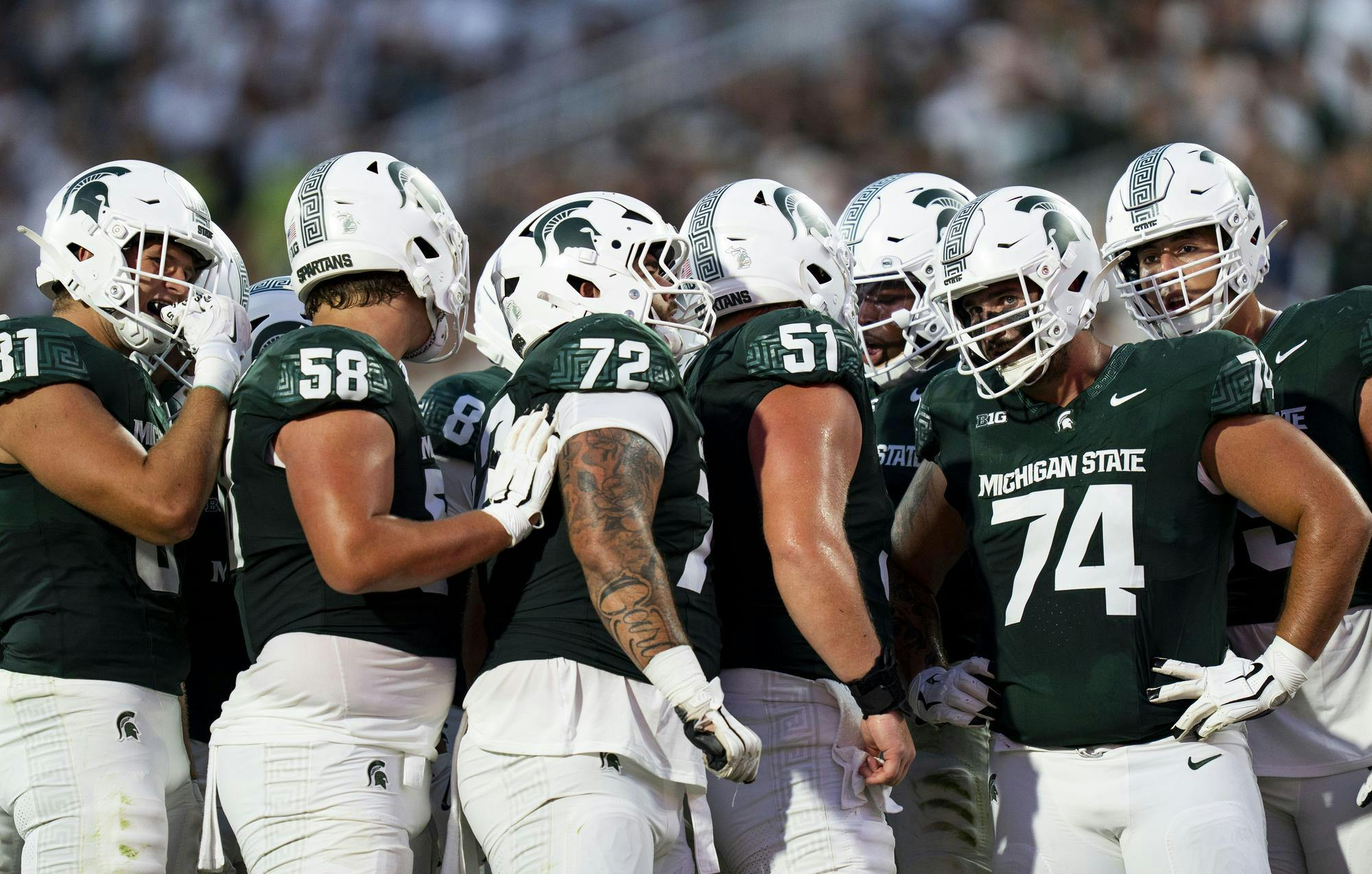 <p>The MSU football players huddle together between plays in Spartan Stadium on Aug. 29, 2025. </p>