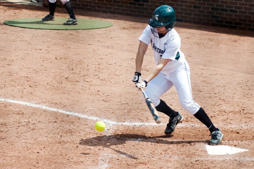 	<p>Senior outfielder Karen Fox eyes a low pitch Saturday afternoon at Secchia Stadium. The Spartans lost Saturday&#8217;s game to Indiana, 7-2. Matt Hallowell/The State News</p>