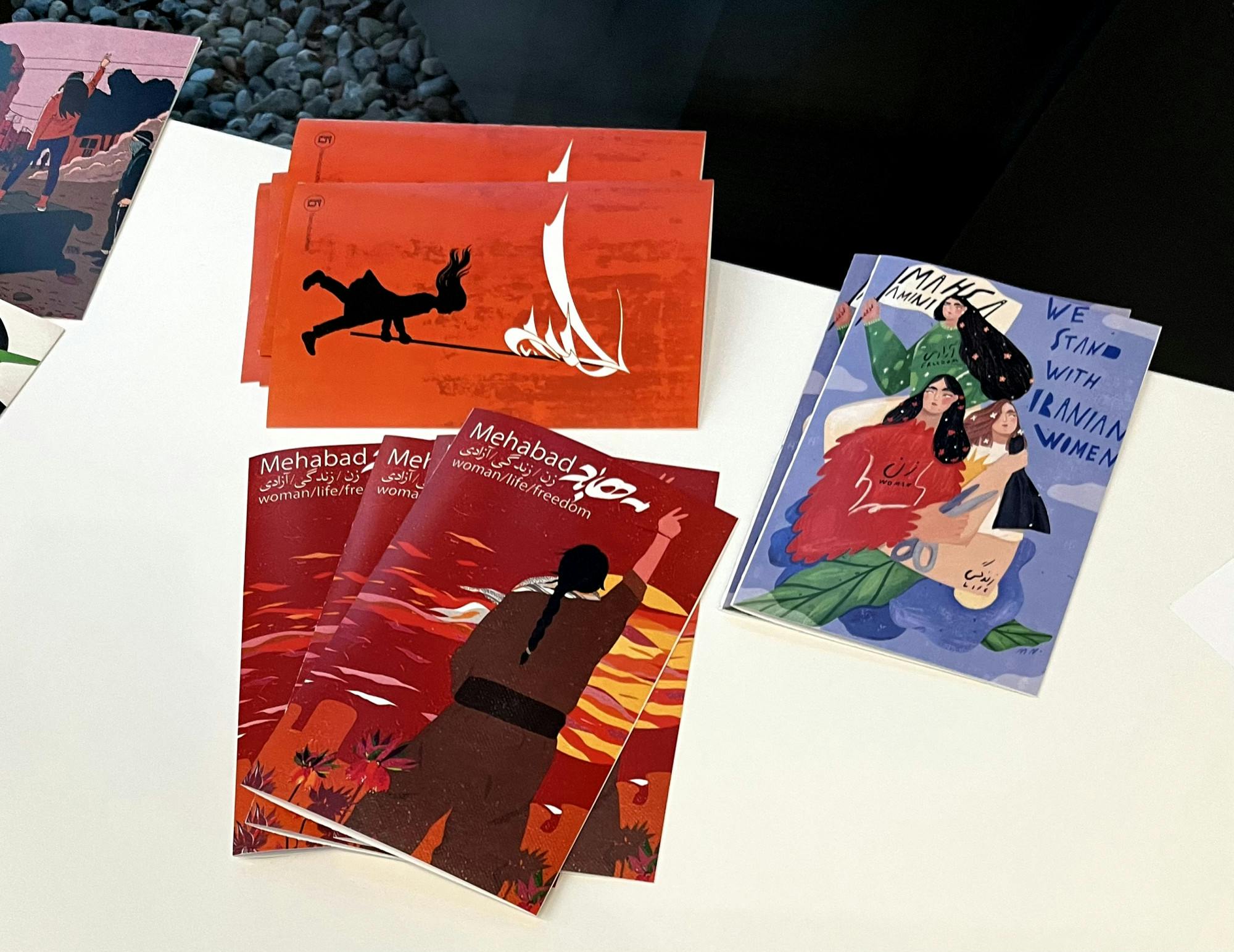 <p><span style="background-color: rgb(248, 248, 248); color: rgb(29, 28, 29);">Programs from the "Woman Life Freedom" event at the Broad Art Museum. Each program cover was painted by Iranian artists, depicting struggle and solidarity in Iran. </span></p>