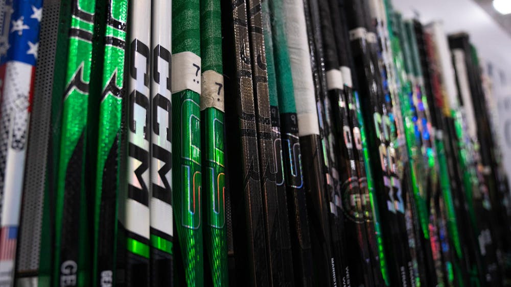 <p>Hockey sticks belonging to the Michigan State team on the bench at USA Hockey Arena in Plymouth, Michigan on Nov. 21, 2024. In front of a sold out crowd, the Spartans captured a convincing 6-2 victory, showcasing why they deserve their ranking of number two in the nation.</p>