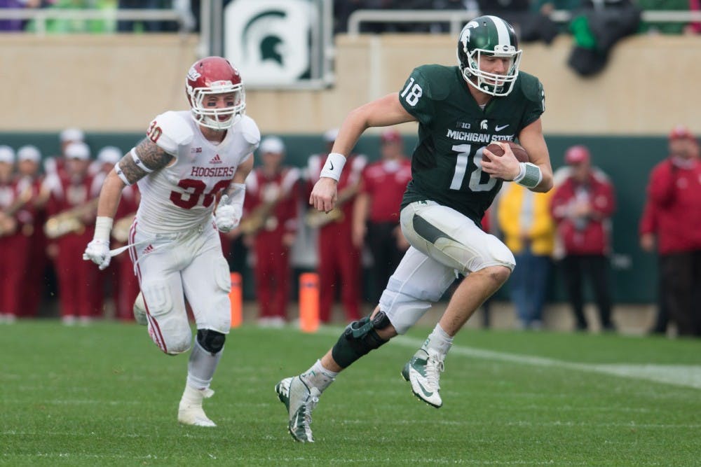 <p>Senior quarterback Connor Cook runs the ball during the game against Indiana on Oct. 24, 2015 at Spartan Stadium. The Spartans defeated the Hoosiers, 52-26.</p>