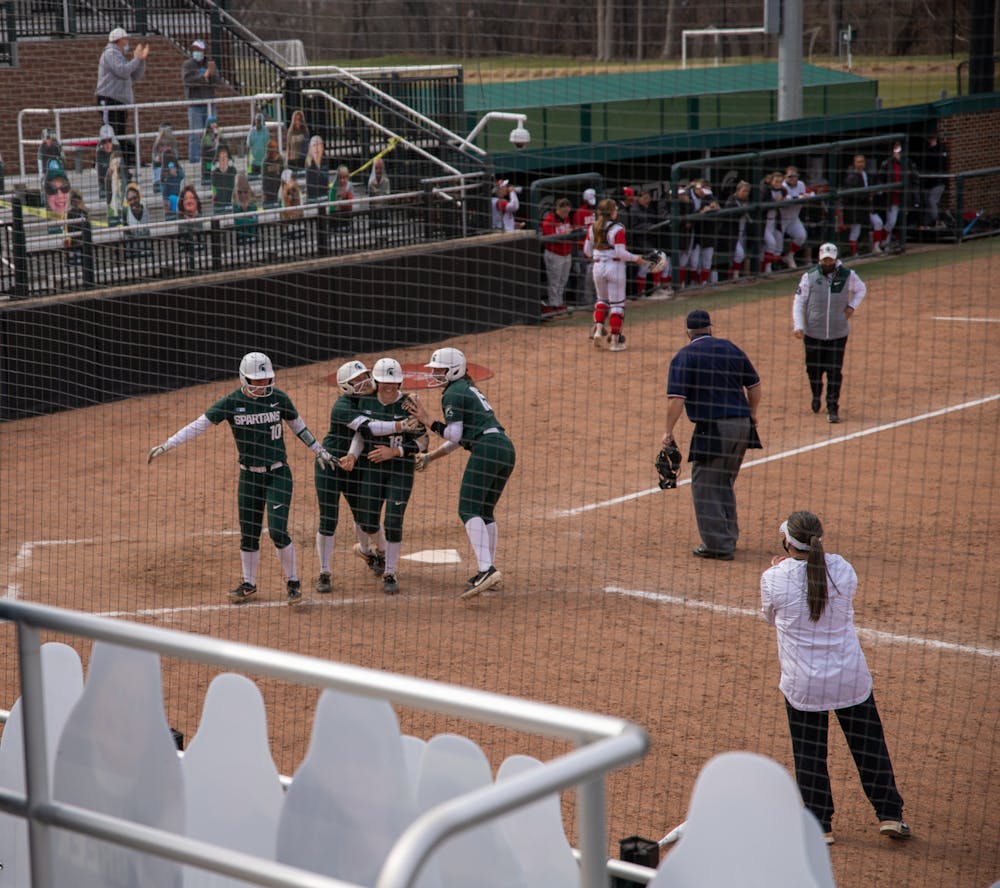 Michigan State's Kendall Kates (18) after coming in to home plate during the game against the Rutgers on Saturday, Mar. 27, 2021 in East Lansing at Secchia Stadium.