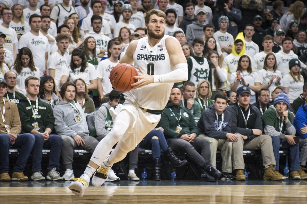<p>Junior guard Kyle Ahrens (0) drives to the net during the men&#x27;s basketball game against Indiana Feb. 2, 2019 at Breslin Center. Nic Antaya/The State News</p>