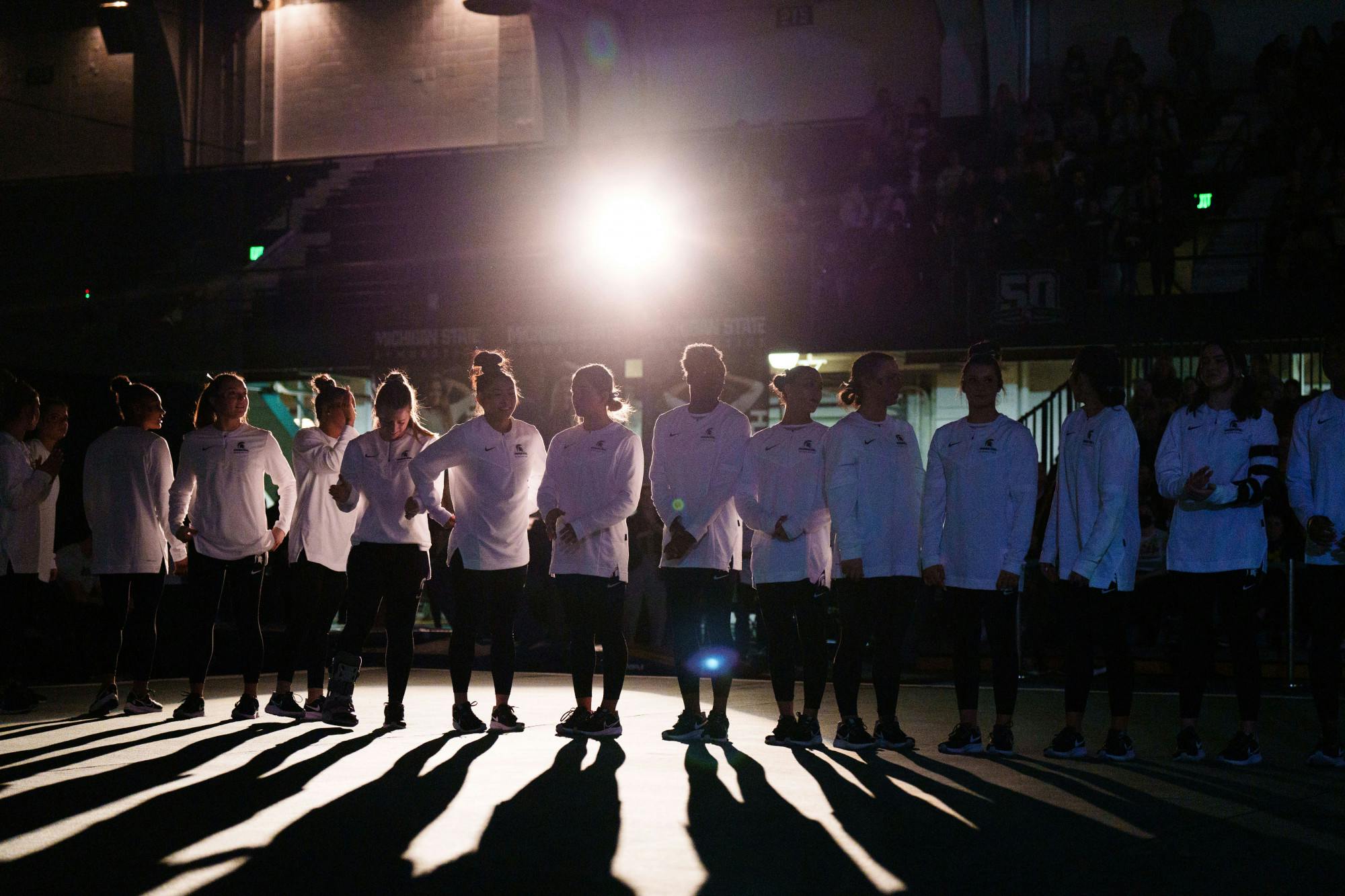 <p>The Michigan State Gymnastics team is introduced before a meet against the University of Michigan on Jan. 22, 2023. The Spartans upset the No. 3 Wolverines with 197.200 points.</p>