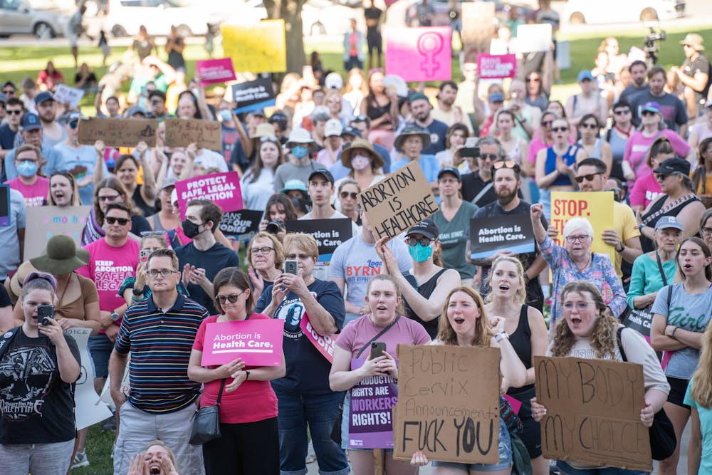 <p>Abortion-rights advocates gather on the Michigan State Capitol lawn on June 24, 2022.</p>