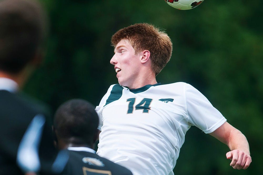 	<p>Freshman midfielder Dewey Lewis takes a header Sunday, Sept. 1, 2013, at DeMartin Stadium at Old College Field. Lewis scored the third of four goals against the Western Michigan Broncos. Katie Stiefel/The State News</p>