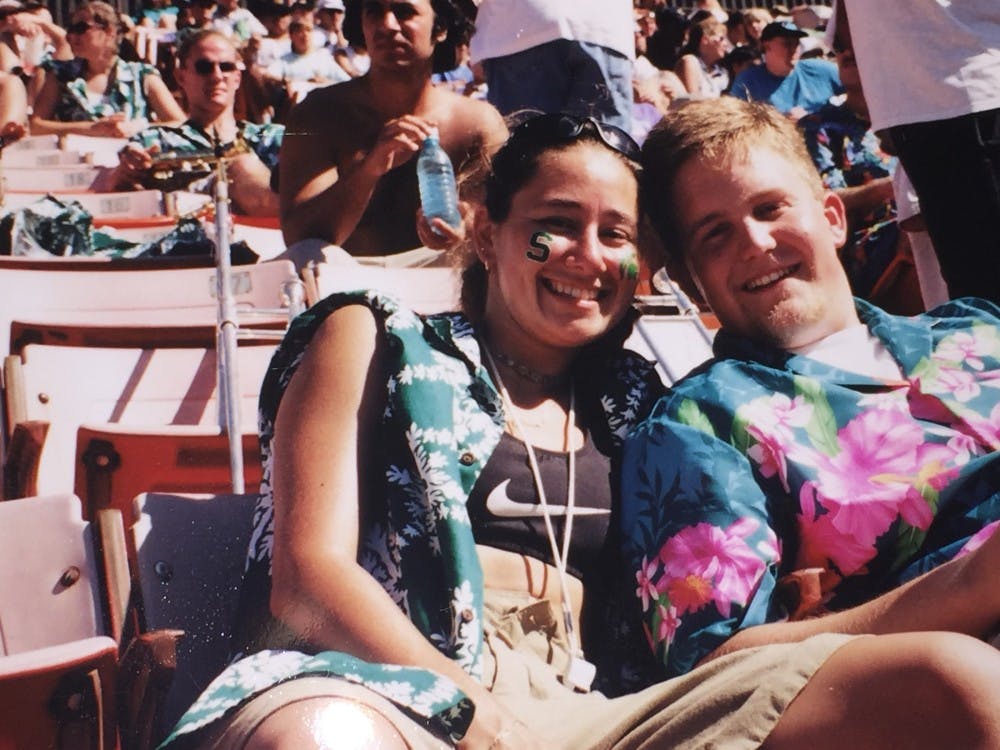 Alumnus Kris Hulliberger, right, and alumna Mary Hulliberger, left, pose for a picture during the Aloha Bowl. Photo courtesy of Mary and Kris Hulliberger 