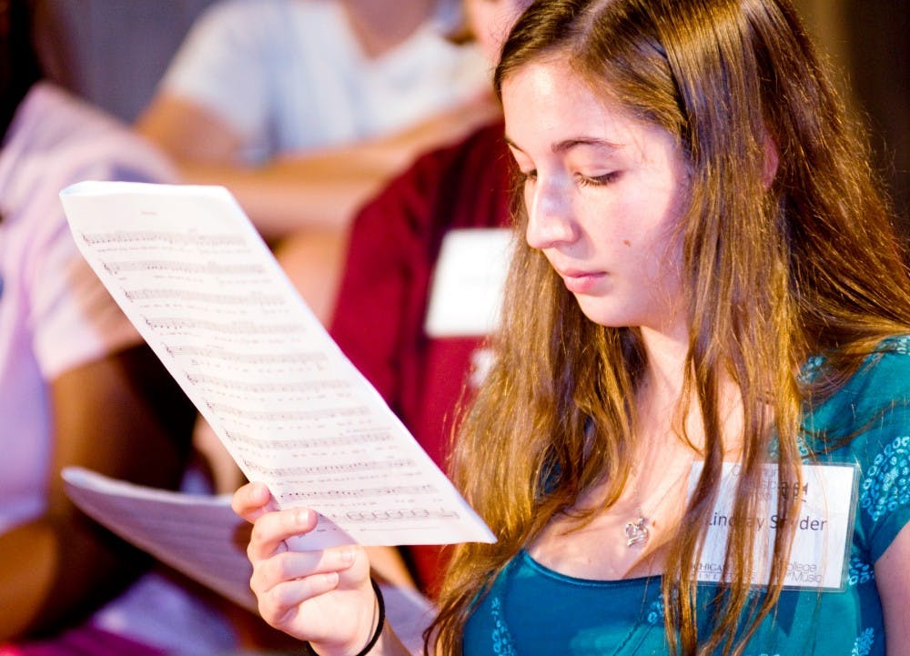 	<p>Lindsay Snyder, 17, rehearses &#8220;Be Our Guest&#8221; from Disney&#8217;s Beauty and the Beast with her peers at Musical Theatre Camp Monday afternoon.  <span class="caps">MSU</span> Community Music School at 841 Timberlane Street in East Lansing runs a yearly theatre camp open to students ages 7 to 18.</p>