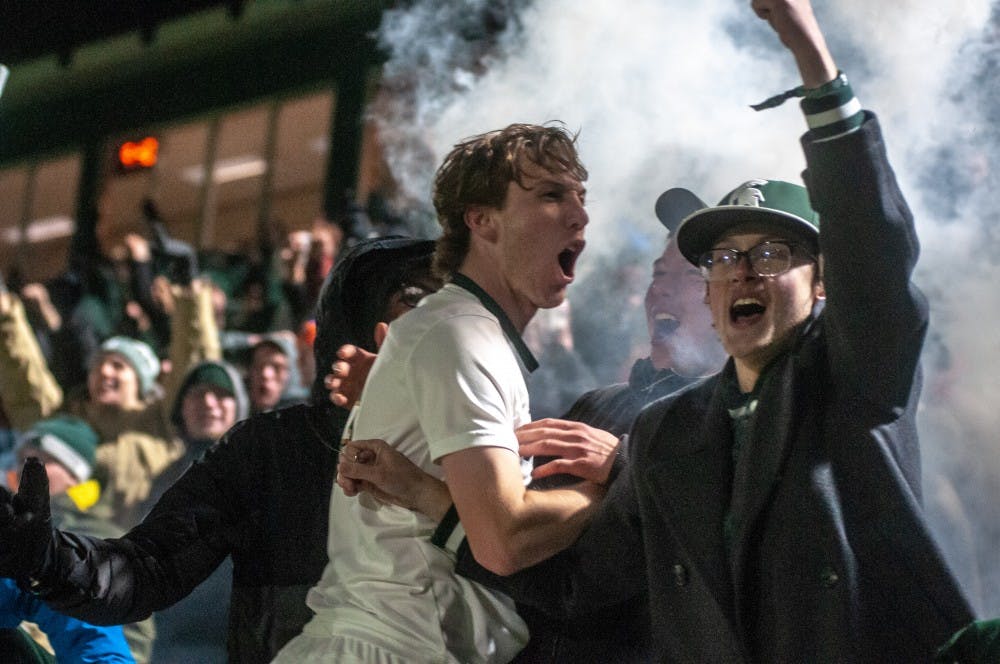 The fans and Spartans celebrate the winning goal during the game against James Madison at DeMartin Stadium on Dec. 1, 2018. The Spartans beat the Duke Dogs, 2-1. The Spartans advance to the College Cup for the first time since 1968.