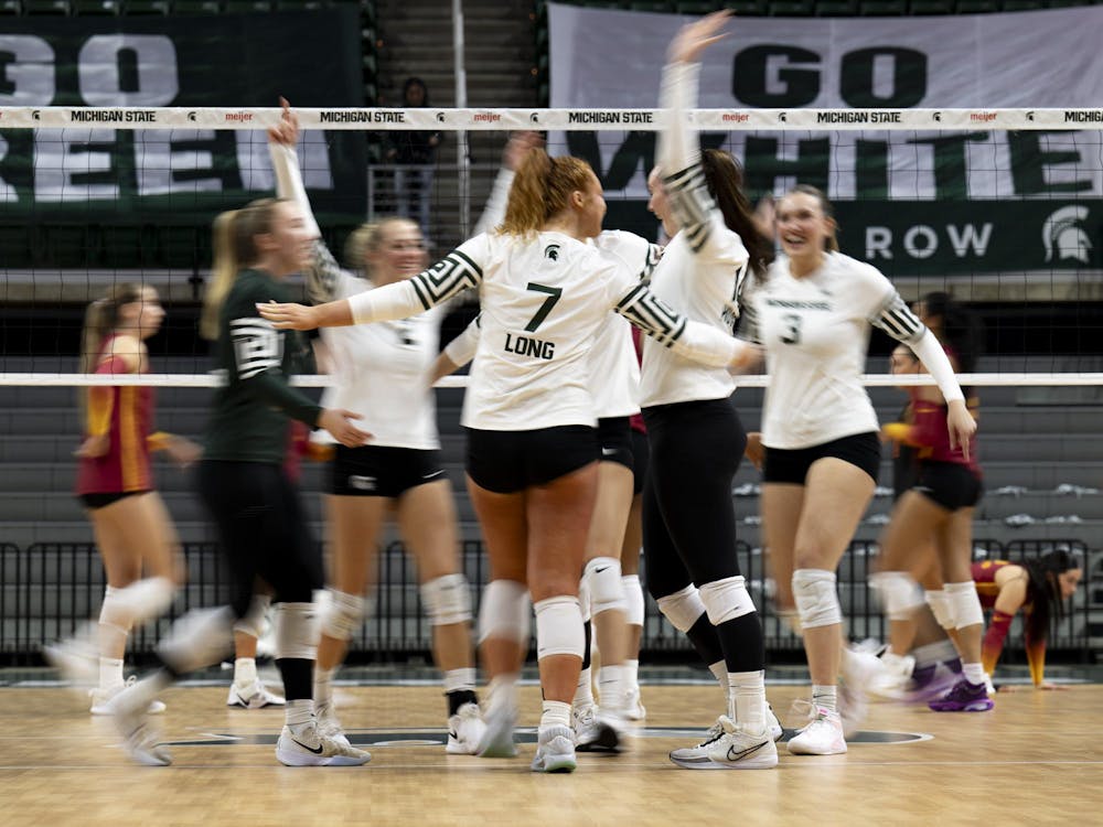 Michigan State players celebrate after scoring a point during the volleyball match against USC at the Breslin Center on Wednesday, Nov. 26, 2025.