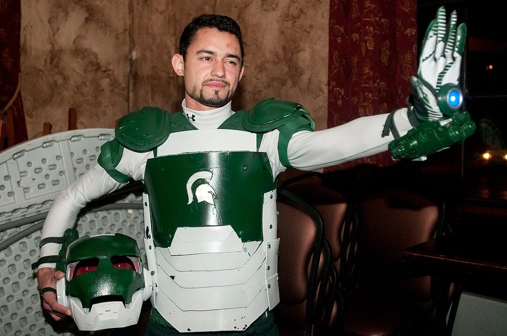 <p>Education senior Mark Wright poses for his Fright Fest costume contest picture Oct. 29, 2014, at Dublin Square Irish Pub. Wright is dressed as the Spartan Iron Man. He made the costume himself. Raymond Williams/The State News</p>