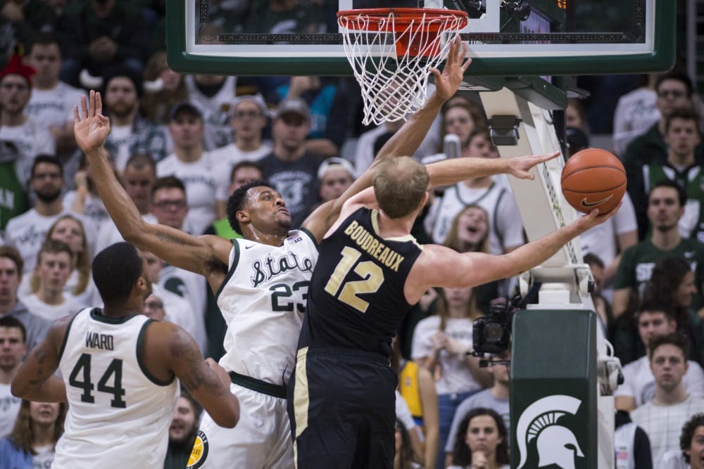 Sophomore forward Xavier Tillman (23) covers Purdue forward Evan Boudreaux (12) during the first half of the men's basketball game against Purdue on Jan. 8, 2018 at Breslin Center. The Spartans defeated the Boilermakers, 77-59.