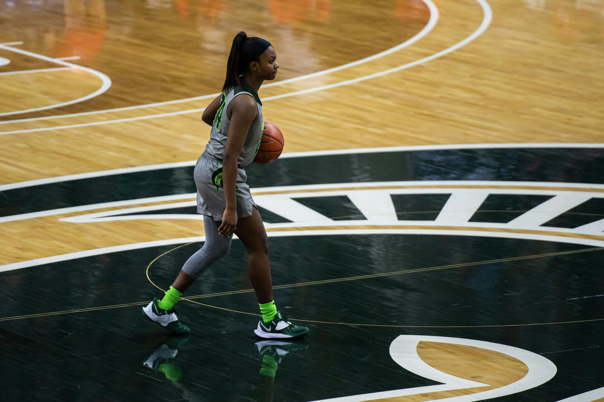 <p>Junior guard Nia Clouden takes the ball up court during a matchup with Maryland on Jan. 7, 2021.</p>
